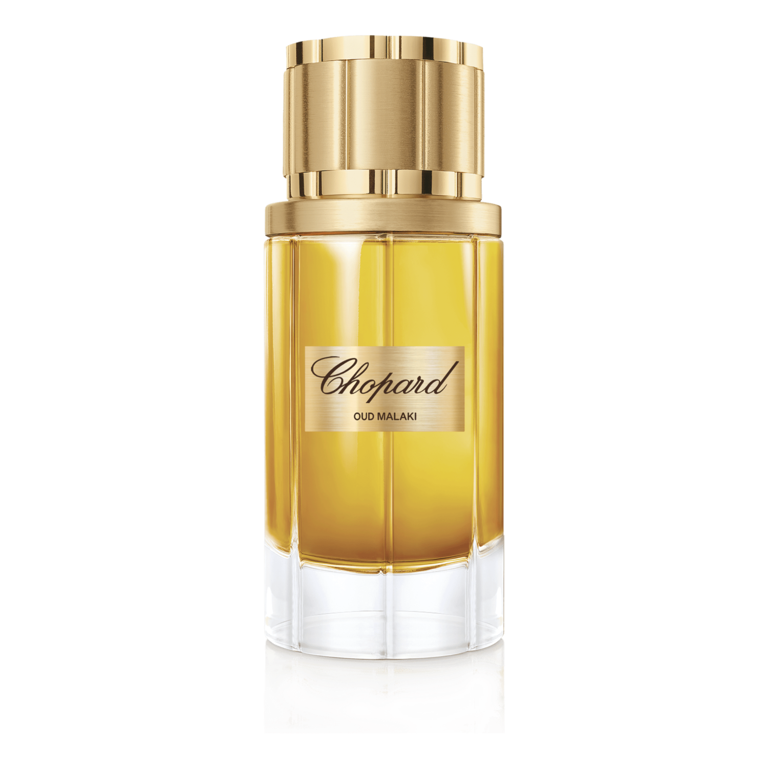 Chopard perfume bottle with gold cap on a green background