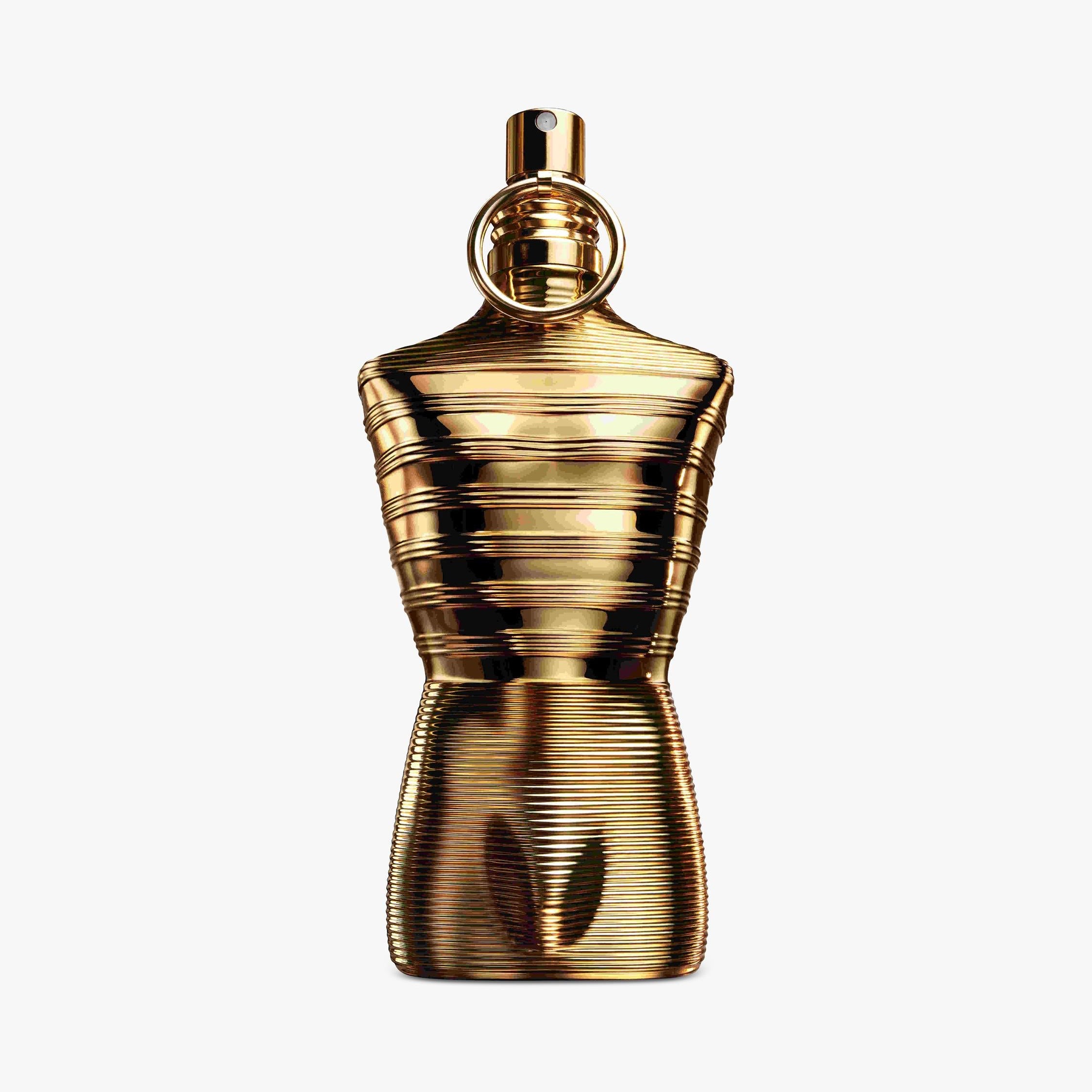 Gold perfume bottle Jean Paul Gaultier Le Male Elixir Absolu on a white background